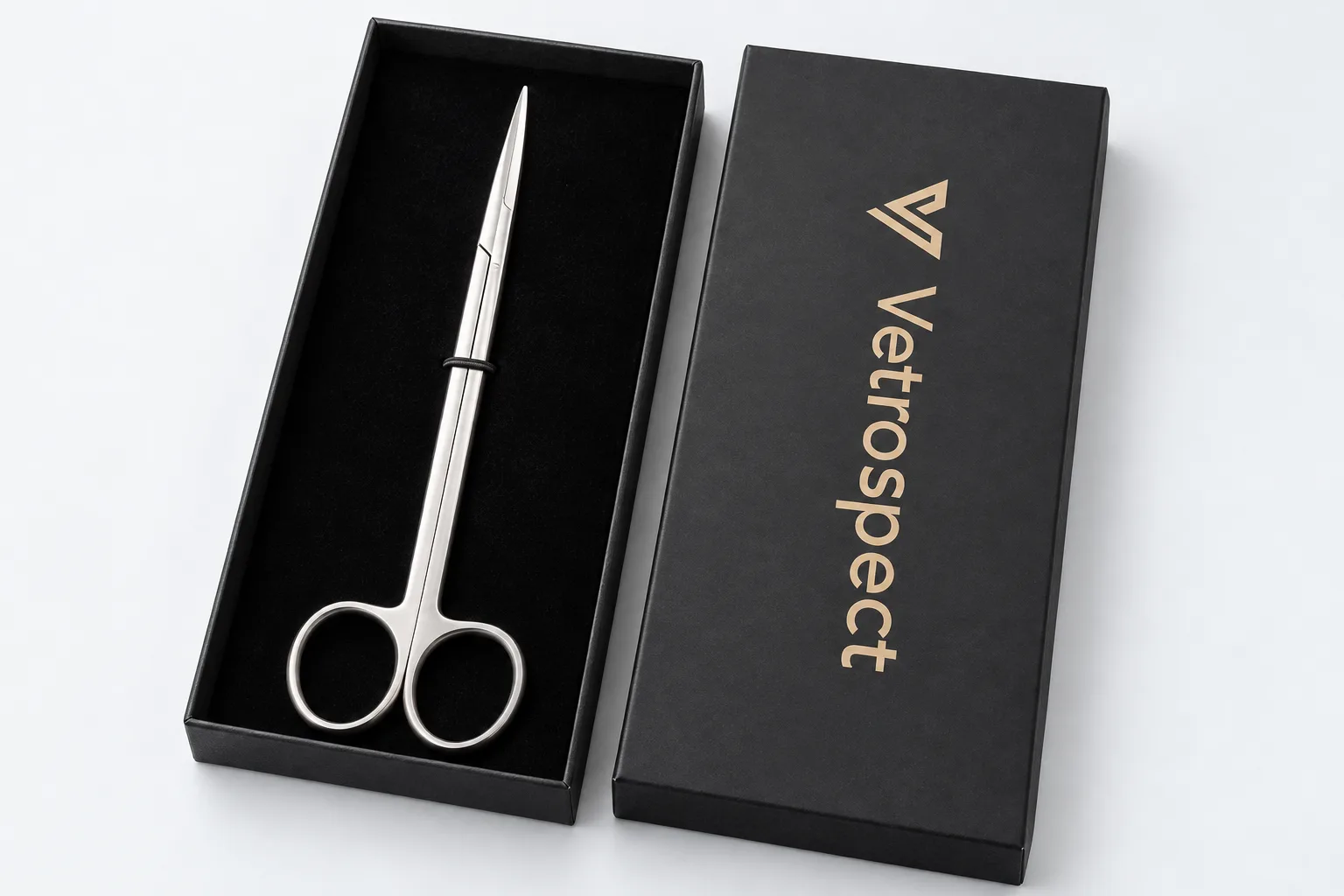 Vetrospect surgical scissors in their open black presentation box, Vetrospect logo in gold on the lid